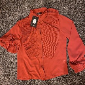 Rust ruffled blouse